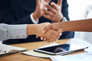 Shaking Hands Prints: Thank you, colleagues shaking hands and in a business meeting in a modern office together
