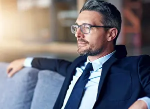 Thoughtful Prints: Thinking, business man and sofa in office for startup inspiration