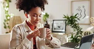 Home Office Prints: Thinking, coffee and woman in home office with laptop