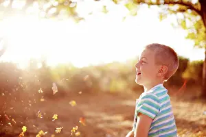 Games Prints: Throwing leaves, profile and boy in park