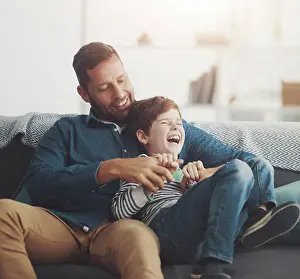 Joke Prints: Tickle, laughing and dad with child on sofa for bonding