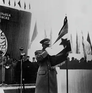Revolutionary Prints: Tito Kisses The Flag -- At a ceremony to mark the tenth anniversary of the Yugoslav People's Army