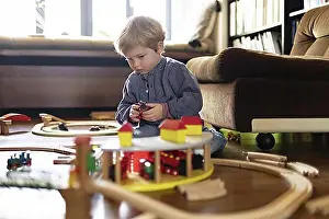 North Rhine Westphalia Prints: Toddler playing with a wooden railway, Bonn, Germany, Europe