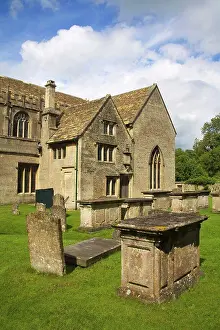 Grave Prints: Tombstones in a cemetery in front of a church