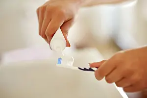 Tooth Prints: Toothpaste, hands and brush for dental health in bathroom with morning hygiene routine at home