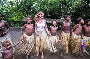Medium Group Prints: Tourist dances with young girls at Yakel Village; Tanna Island, Vanuatu