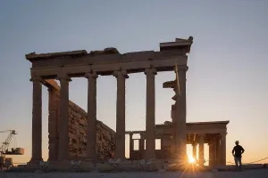 Visiting Prints: Tourist man sightseeing at the Acropolis at sunset on summer vacation