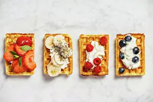 Back Ground Prints: Traditional belgian waffles with whipped cream and fresh fruits and berries on white marble background