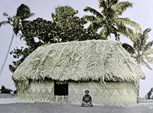 Tonga Prints: Traditional village home made from coconut leaves and wood; Tonga 1953