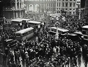 Group Of People Prints: A traffic block caused by the crowd watching the hunger marchers demonstrating in Trafalgar Square