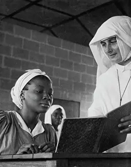 Artifacts Prints: Training Of Women Teachers In ia -- Student receiving individual attention from a teacher