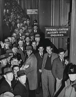 1946 Prints: Tramway men receiving then has for the lost week of work. October 28, 1946