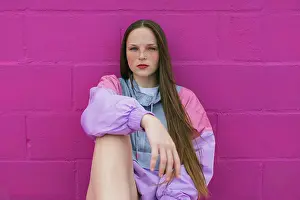 Activewear Prints: Trendy teenager with roller skates sitting near pink wall