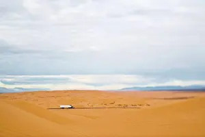 Unitedstates Prints: Truck Driving Through Desert