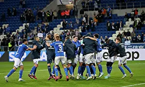 Sports Facility Prints: TSG 1899 Hoffenheim players dance and celebrate their victory in front of the fan curve
