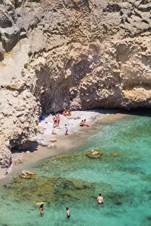 Tropical Climate Prints: Tsigado Beach with tourists in the turquoise water; Milos Island, Cyclades, Greece