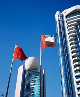 Arabic Prints: Uae, Dubai, Deira, Etisalat Building On Dubai Creek With Flag Poles In Foreground