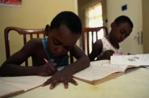 Lessons Prints: Uganda, Kampala, Two Young Children Doing Homework