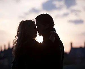 Above 18 Prints: UK, London, Silhouette of couple kissing at sunset
