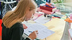 Desk Prints: UK, Surrey, Girl doing homework