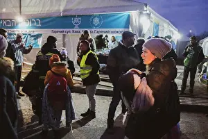 Society Prints: Ukranian refugees cross the border from Ukraine into Romania