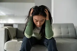 Personal Prints: Unhappy depressed young Asian woman feeling sad