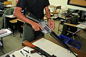 Uniform Prints: Uniformed police officer at a weapon and firearms training course at the Panamanian National Police force academy