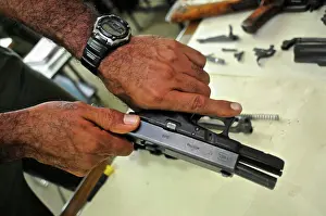 Uniform Prints: Uniformed police officer at a weapon and firearms training course at the Panamanian National Police force academy
