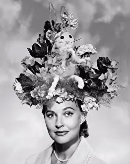 1950 Prints: United States: c. 1950 A portrait of an elegant woman wearing a large Easter bonnet