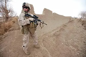 Danger Prints: A United States Marine, holding an M4 Carbine