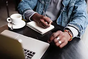 Businesswomen Prints: Unrecognisable man writing notebook