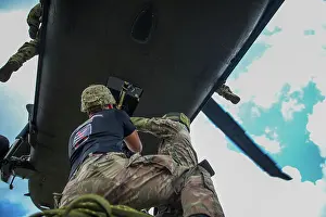 Helicopter Prints: U.S. Army Soldiers assigned to the 10th Combat Aviation Brigade provide UH-60M Black Hawk support to the 10th Mountain