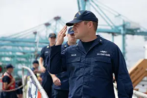 Patrol Prints: U.S. Coast Guard Chief Petty Officer Paul Taylor salutes the national ensign before exiting the brow of Coast Guard