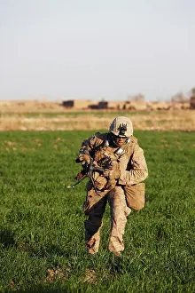 Race Prints: A U.S. Marine Machine Gunner Sprints Across a Field During a Combat Operation in Afghanistan's Helmand Province