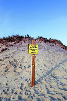 Rope Prints: USA, Massachusetts, Cape Cod. A warning sign on a sand dune in Cape Cod