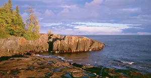 Large Format Prints: USA, Minnesota, Lichen covered rocks and stormy sky over Lake Superior at Artist Point
