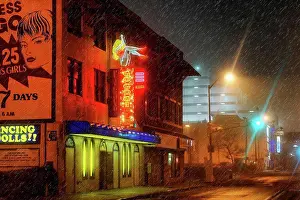 Late Prints: USA, New Jersey, Atlantic City. The neon lights of a strip club shine through the rain