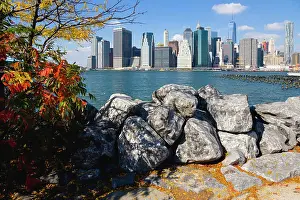 Lower Prints: USA, New York, Lower Manhattan skyline skyscrapers and East River seen in autumn from Brooklyn Bridge Park