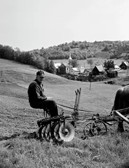 Rural Scene Prints: USA, Vermont, Corinth, farmer sitting on agriculture machine pulling by horse