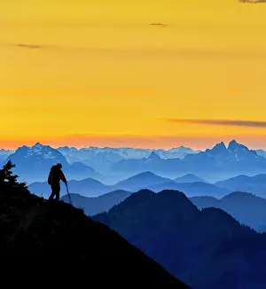 Model Release Prints: USA, Washington State. A backpacker descending from the Skyline Divide in the North Cascades near Mt