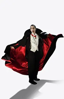 Halloween Prints: A vampire against a white background holding his arms out at camera with mouth wide open