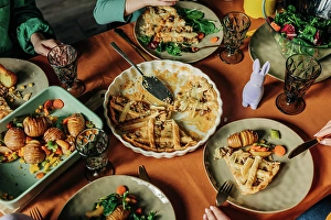 50 To 60 Years Prints: Various food kept on dining table at Easter dinner