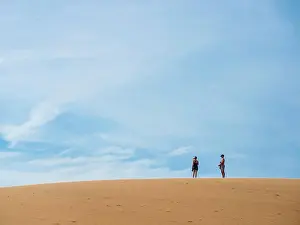 Model Release Prints: Vietnam, Mui Ne. People on sand dune. (MR)