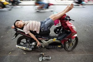 Motorbike Prints: Vietnam, Vietnam, Ho Chi Minh City, Boy Sleeping on Motorbike