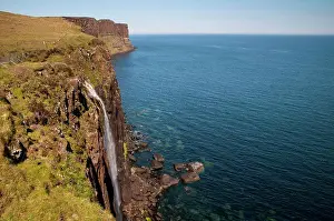 Cliffs Prints: View of coastline with waterfall tumbling over cliffs into sea