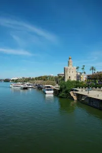 Watchtower Prints: View of the Guadalquivir River and the Torre del Oro (Gold Tower) is a dodecagonal military watchtower in Seville