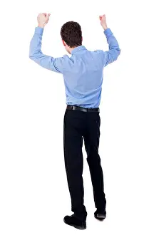 Rear Prints: Back view of man. Raised his fist up in victory sign
