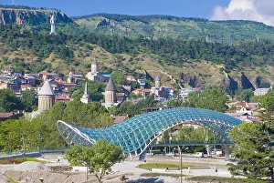 Glass Material Prints: View over the old town of Tiblisi with a new constructed pedestrian bridge