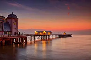 Water S Prints: View of Victorian pier in seaside town at sunrise