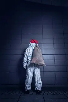 Germany Prints: Back View of a volunteer, dressed in the coverall used against coronavirus